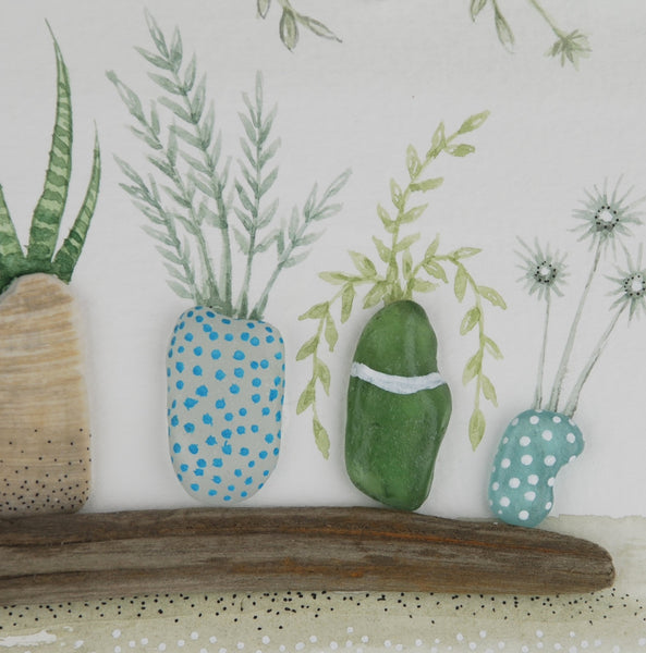 Watercolour painting of houseplants with sea glass and driftwood