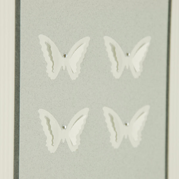 hand-made greeting card with off-white paper butterflies on pale grey card with diamante decoration