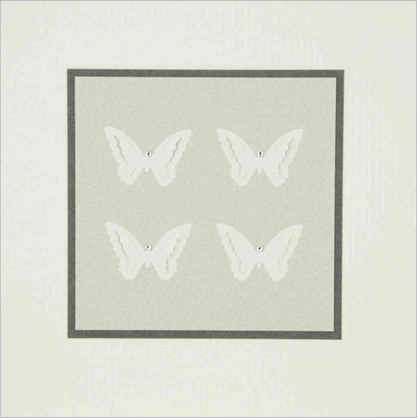 hand-made greeting card with off-white paper butterflies on pale grey card with diamante decoration